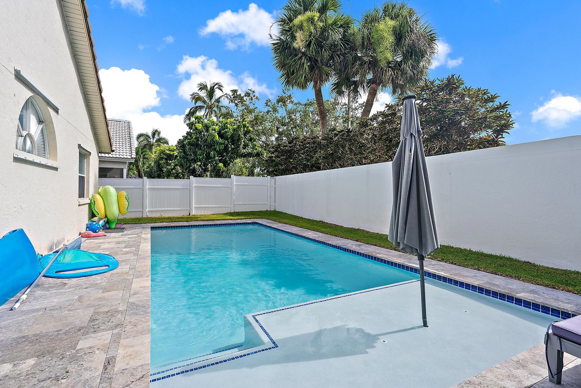 159 St Michaels Court Jupiter, FL 33458 - Photo 2 of 22 a view of a backyard