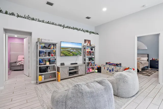 a bed room with a bed and a book shelf