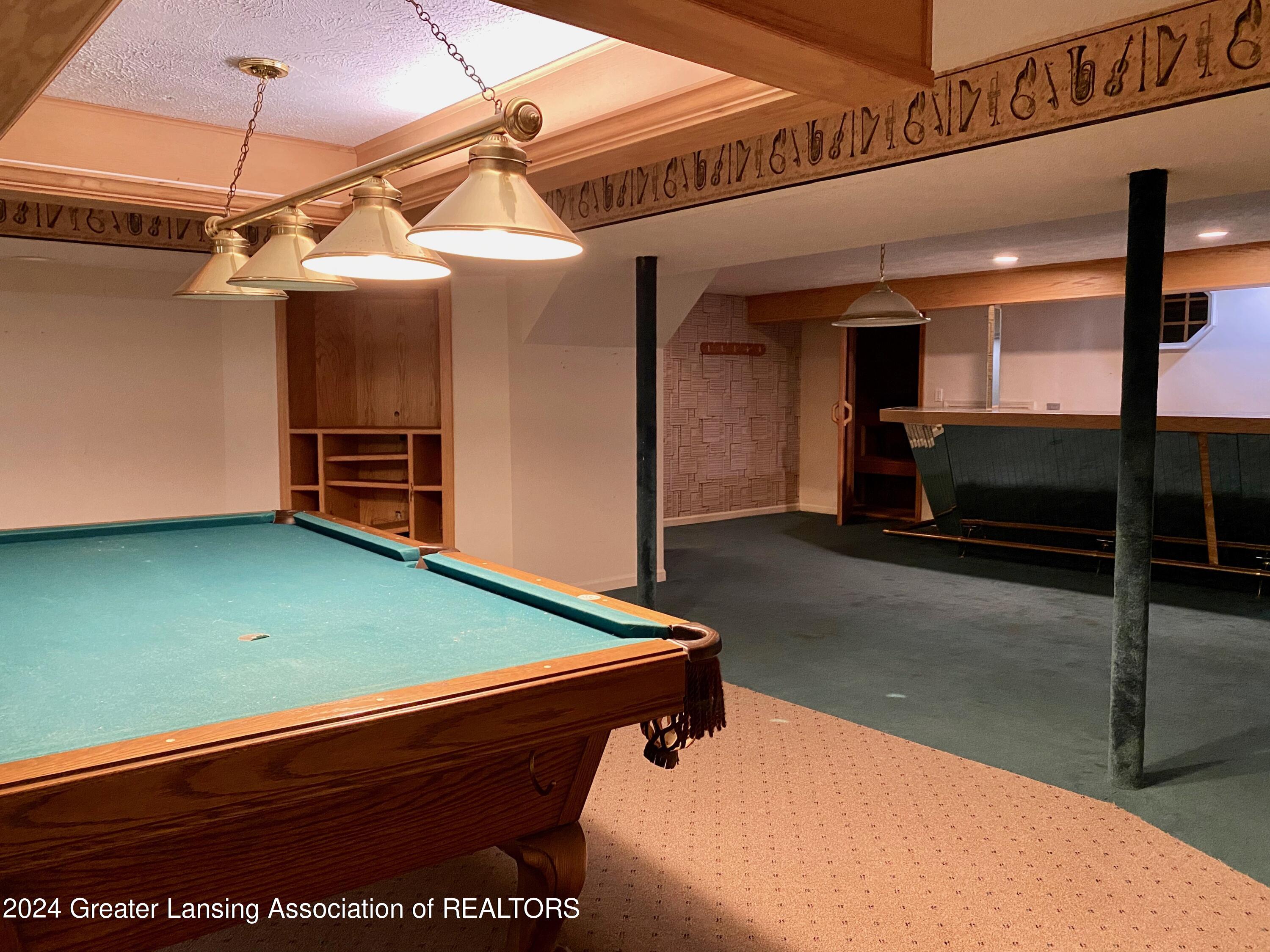 1526 Riley Ridge Drive Lansing, MI 48917 - Photo 47 of 52 Bar and pool
