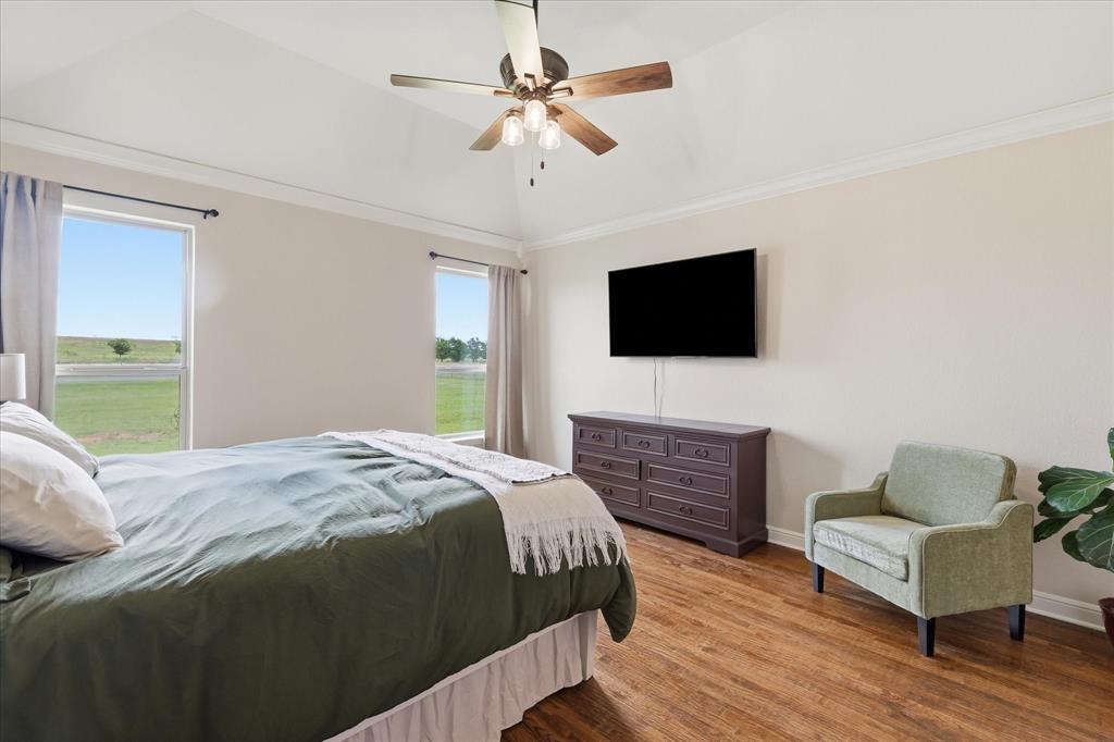 160 Vista Ridge North Decatur, TX 76234 - Photo 20 of 40 a bedroom with a bed and a flat screen tv
