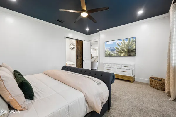a bedroom with a bed and a view of bathroom
