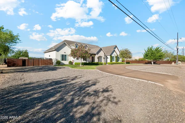 a living room with fireplace furniture and a floor to ceiling window
