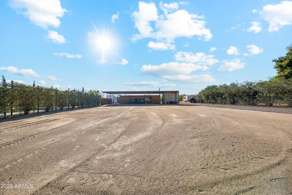 an aerial view of a house with outdoor space and lake view