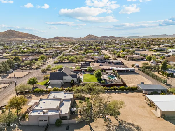 a view of patio with a table and chairs under an umbrella with a patio