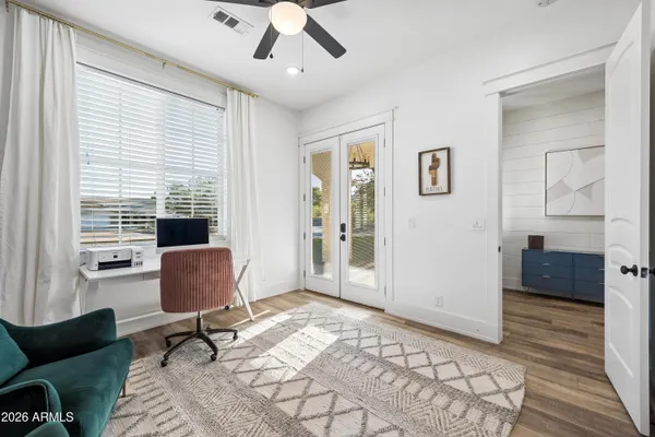 a living room with furniture and a rug