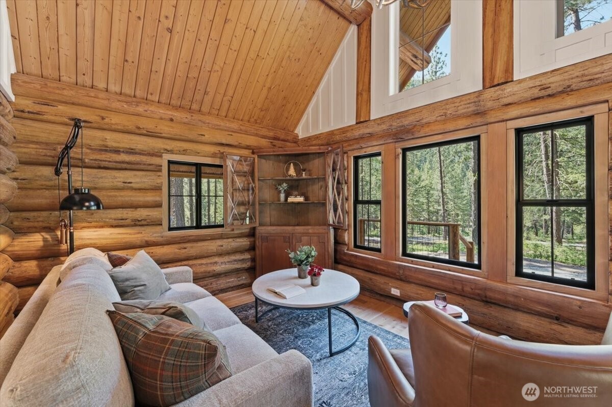 2350 First Crk Road Chelan, WA 98816 - Photo 11 of 39 a living room filled with furniture and a potted plant