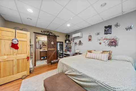 a bedroom with a bed and walk in closet