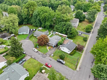 an aerial view of a house with a garden