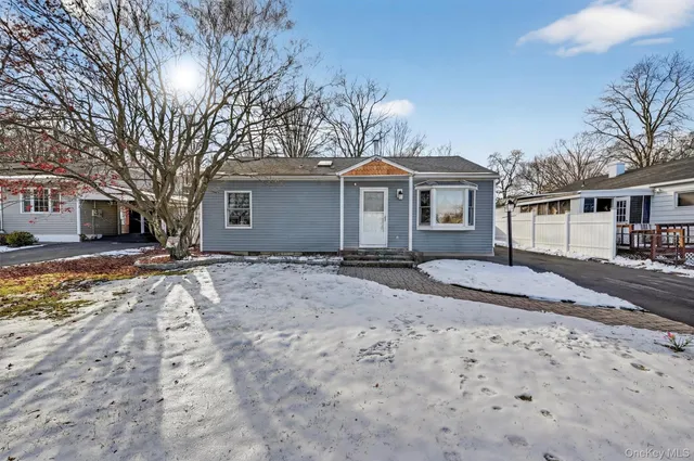 a picture of a bench in front of a building