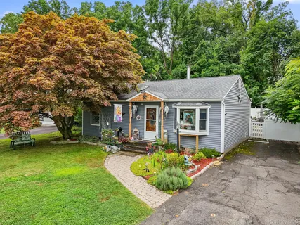 a view of a house with a yard patio and a patio