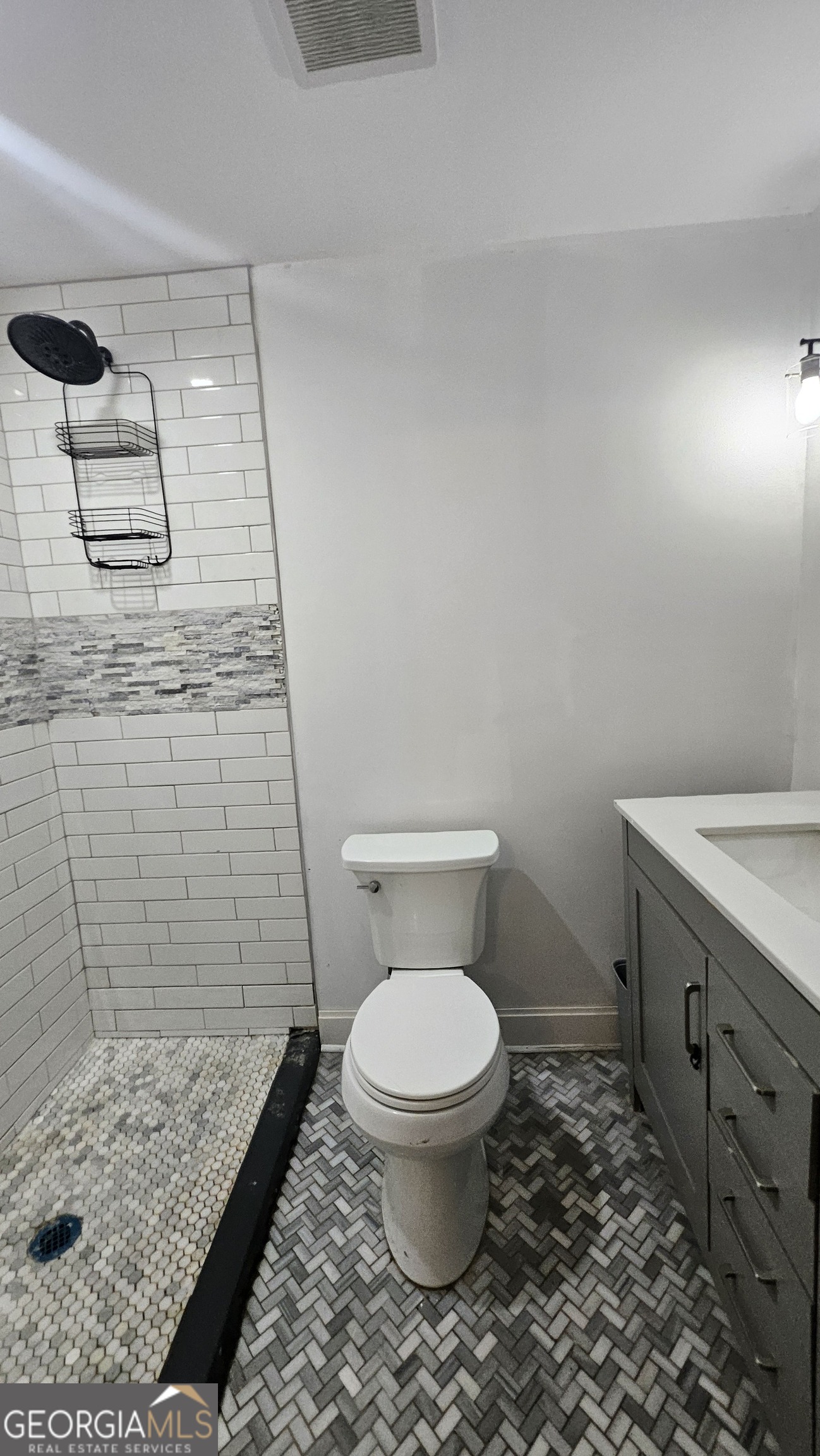 2197 Polar Rock Place Southwest Atlanta, GA 30315 - Photo 5 of 9 a bathroom with a toilet and a shower