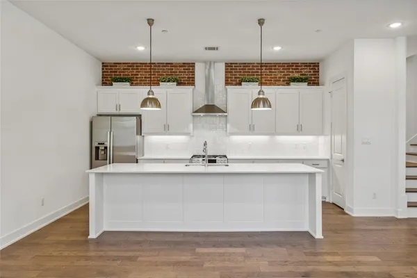 a view of living room with furniture and chandelier