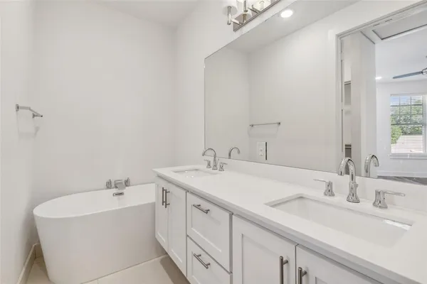 a bathroom with a sink and a bathtub