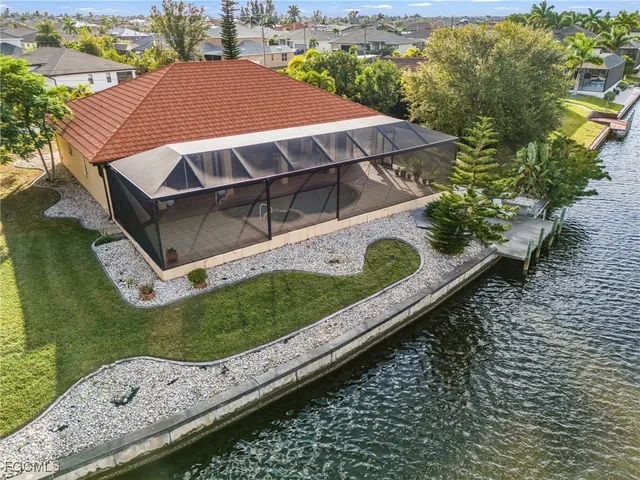 a aerial view of a house with a yard