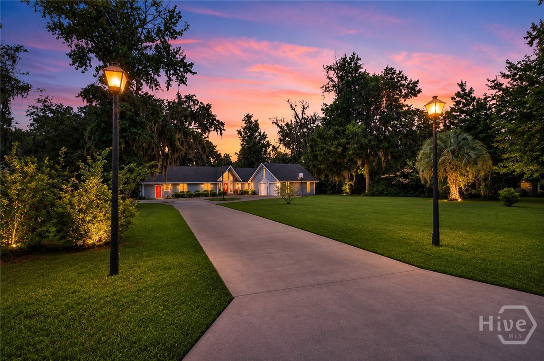 198 Dutchman's Cove Road Midway, GA 31320 - Photo 1 of 39 Front Photo Exterior - Twilight - Grass Virtually Enhanced