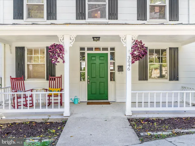 a view of a livingroom with furniture and a potted plant