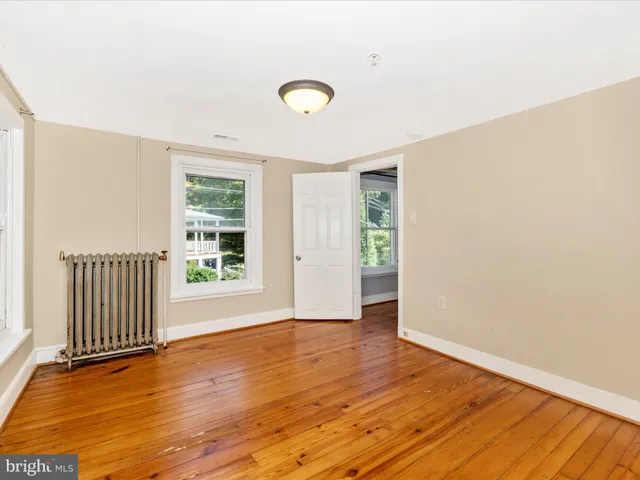 a view of a large yard with lots of bushes