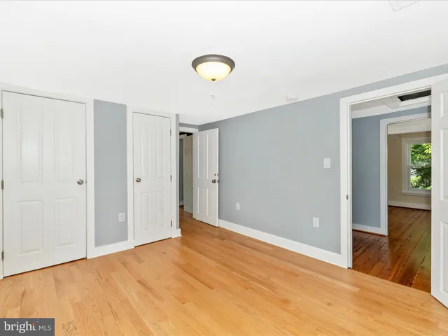 a view of a house with backyard sitting area and garden