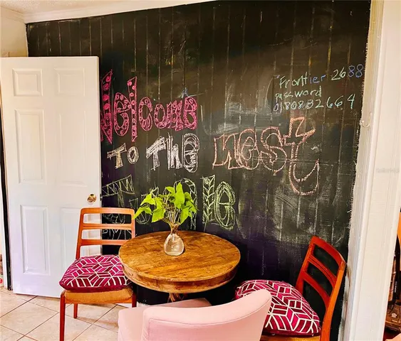 a bathroom with a toilet and shower curtain