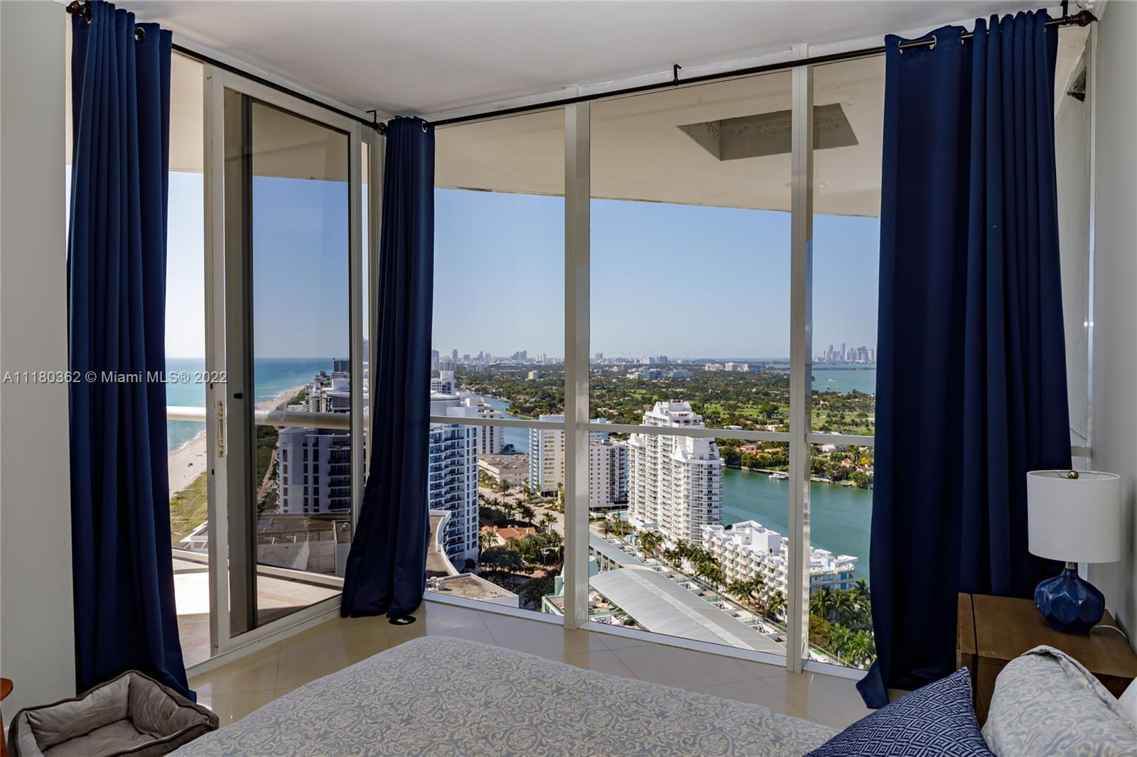 6301 Collins Avenue, Unit PH4 Miami Beach, FL 33141 - Photo 13 of 18 a living room with furniture and floor to ceiling window