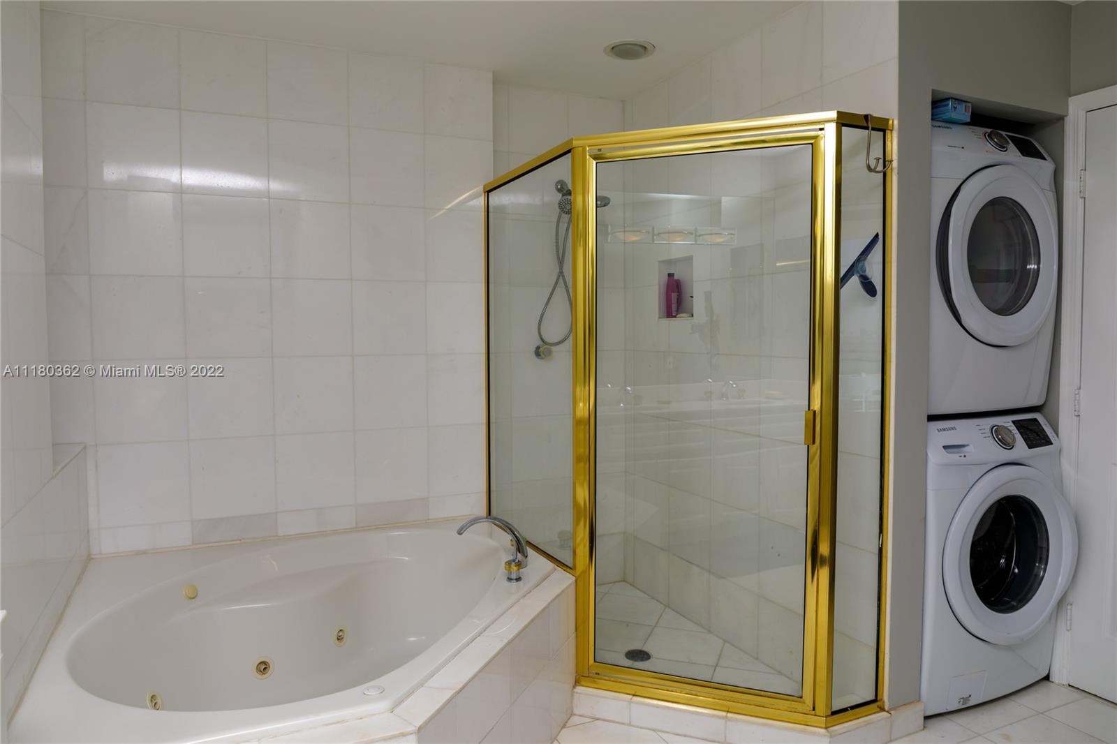 6301 Collins Avenue, Unit PH4 Miami Beach, FL 33141 - Photo 16 of 18 a bathroom with a bathtub and a shower