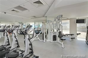 6301 Collins Avenue, Unit PH4 Miami Beach, FL 33141 - Photo 17 of 18 a view of a room with gym equipment