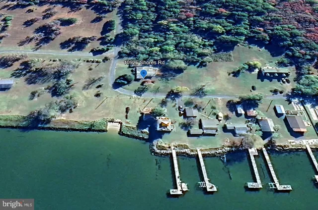 an aerial view of a house with a yard basket ball court