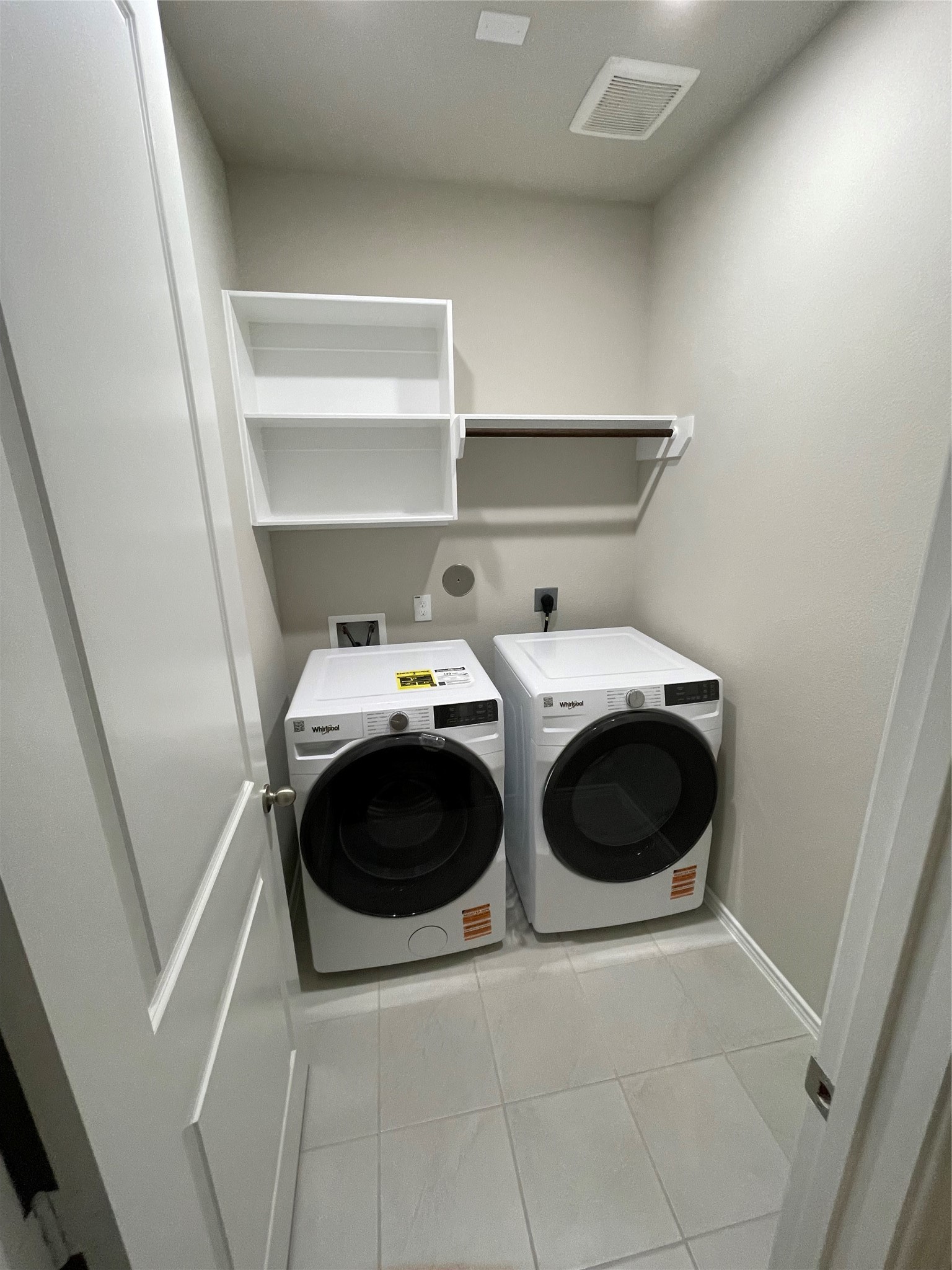 2302 Hazel Berry Street Manvel, TX 77578 - Photo 12 of 27 a utility room with dryer and washer