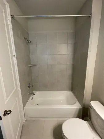 a bathroom with a sink toilet and mirror