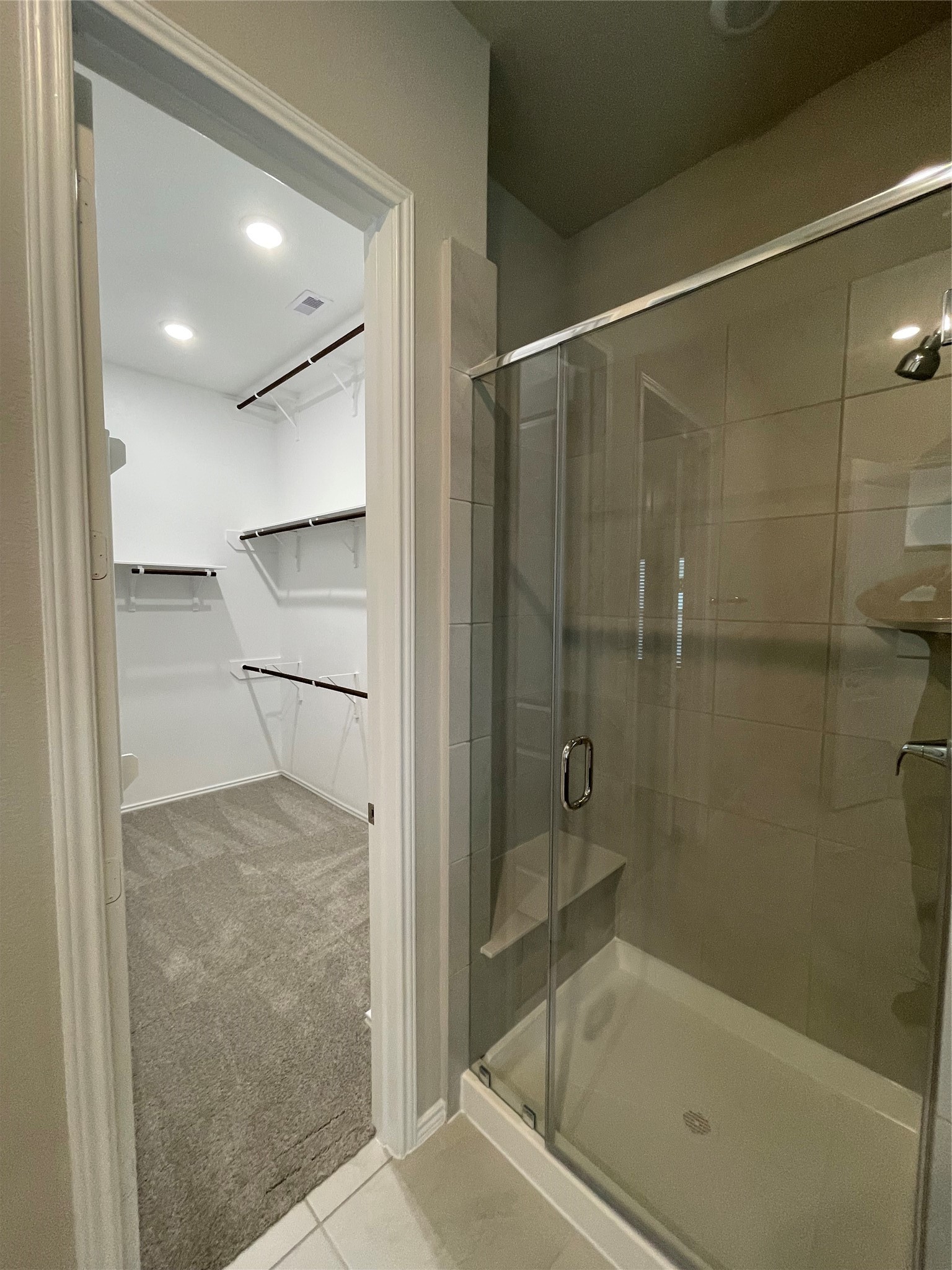 2302 Hazel Berry Street Manvel, TX 77578 - Photo 26 of 27 a bathroom with a glass shower door