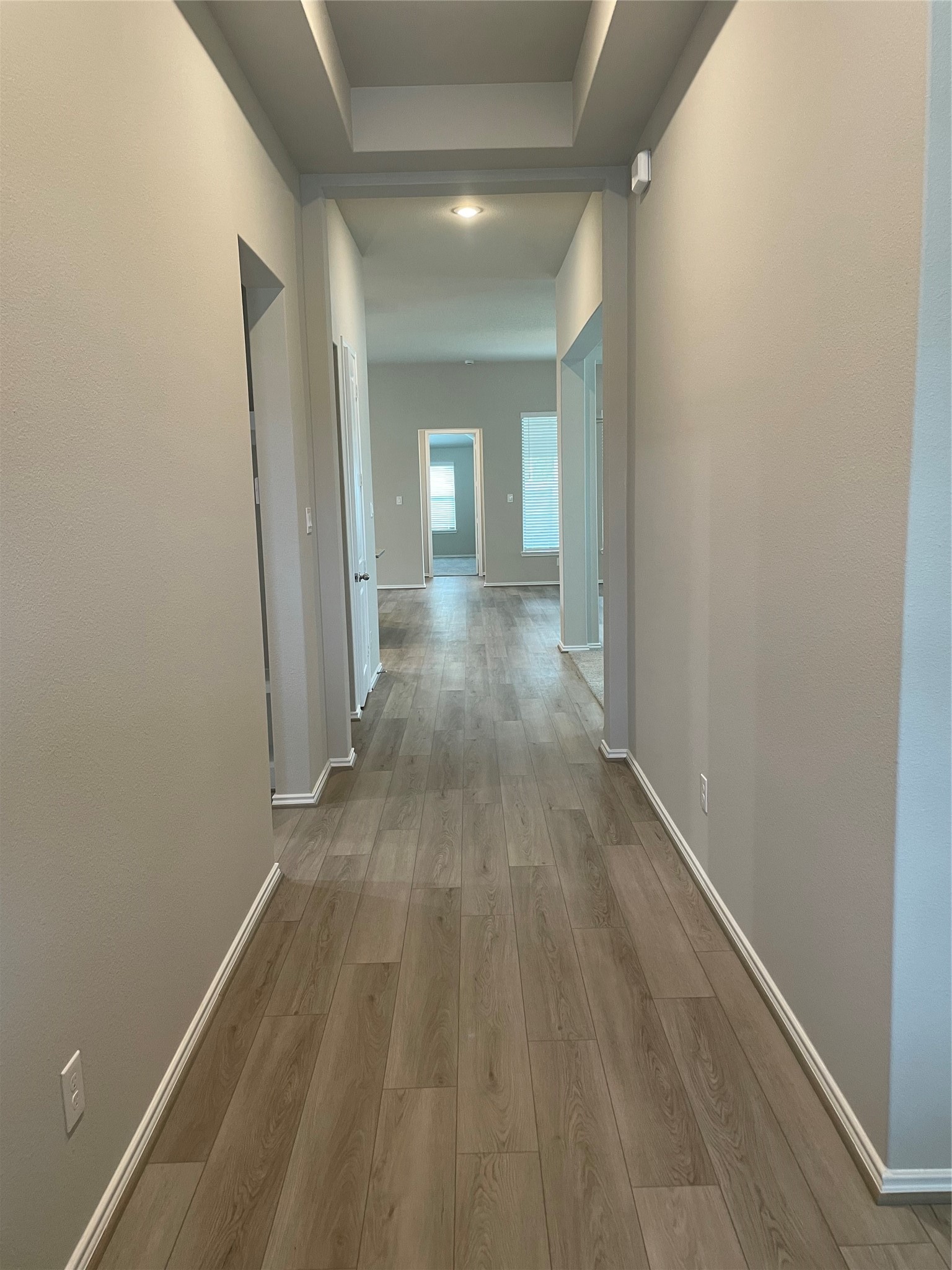 2302 Hazel Berry Street Manvel, TX 77578 - Photo 3 of 27 a view of a hallway with wooden floor
