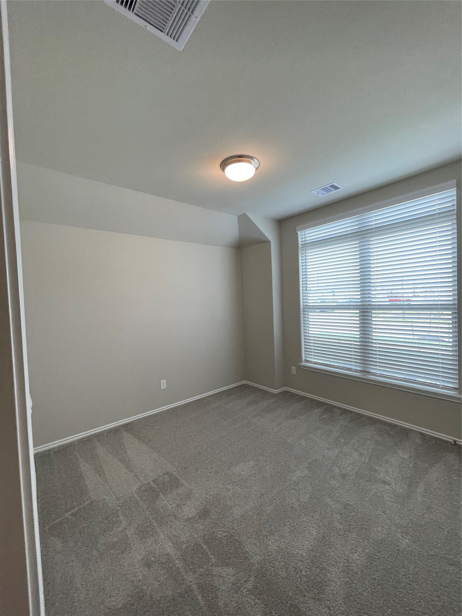 2302 Hazel Berry Street Manvel, TX 77578 - Photo 10 of 27 an empty room with a empty space and window