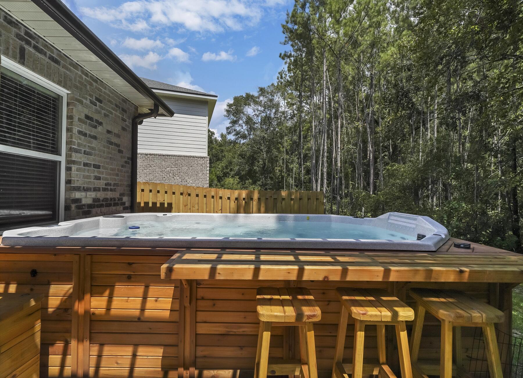 29 Laurel Oaks Drive Freeport, FL 32439 - Photo 37 of 53 a view of a chairs and table on the deck