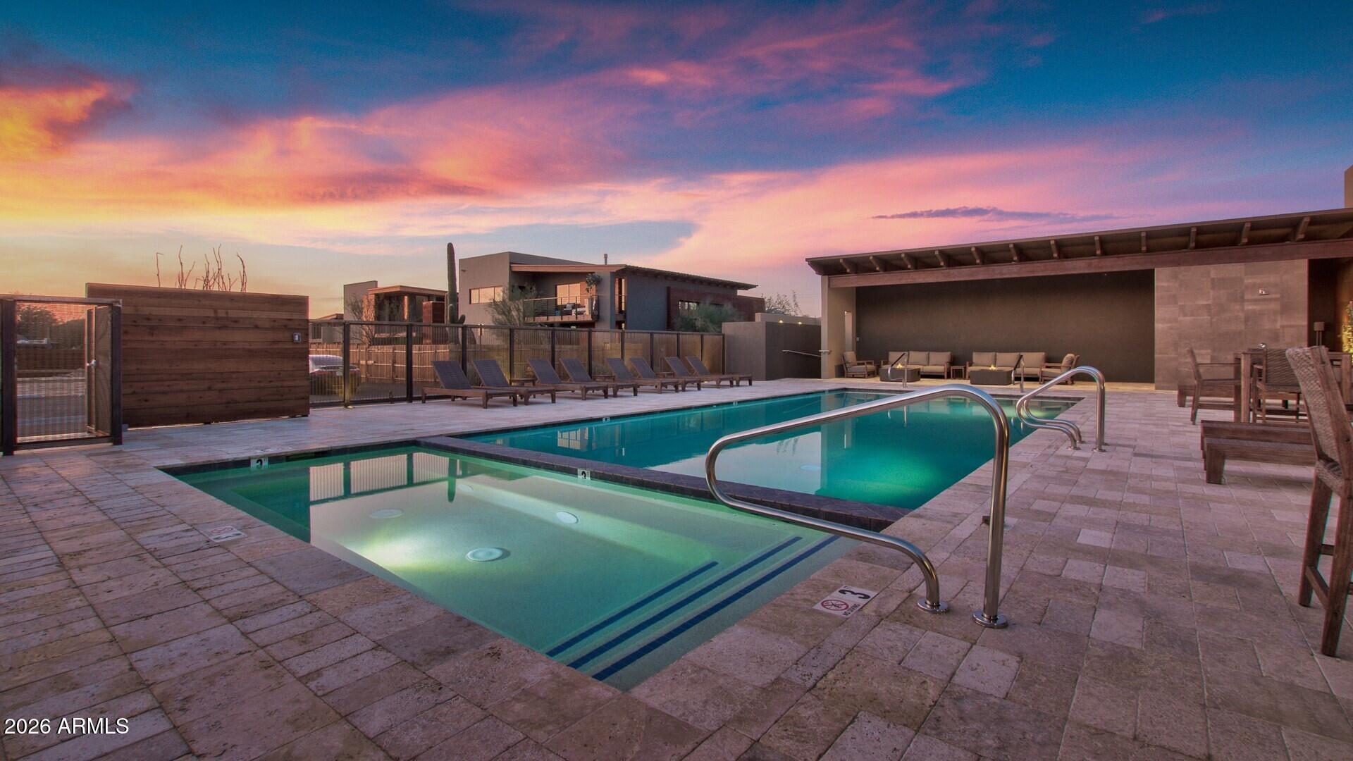 6525 East Cave Creek Road, Unit 105 Cave Creek, AZ 85331 - Photo 12 of 14 a view of a swimming pool with a lounge chairs
