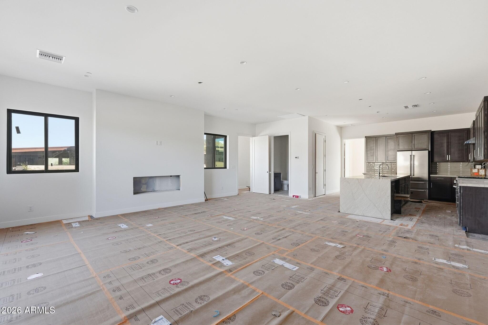 6525 East Cave Creek Road, Unit 105 Cave Creek, AZ 85331 - Photo 4 of 14 a view of a livingroom with a kitchen