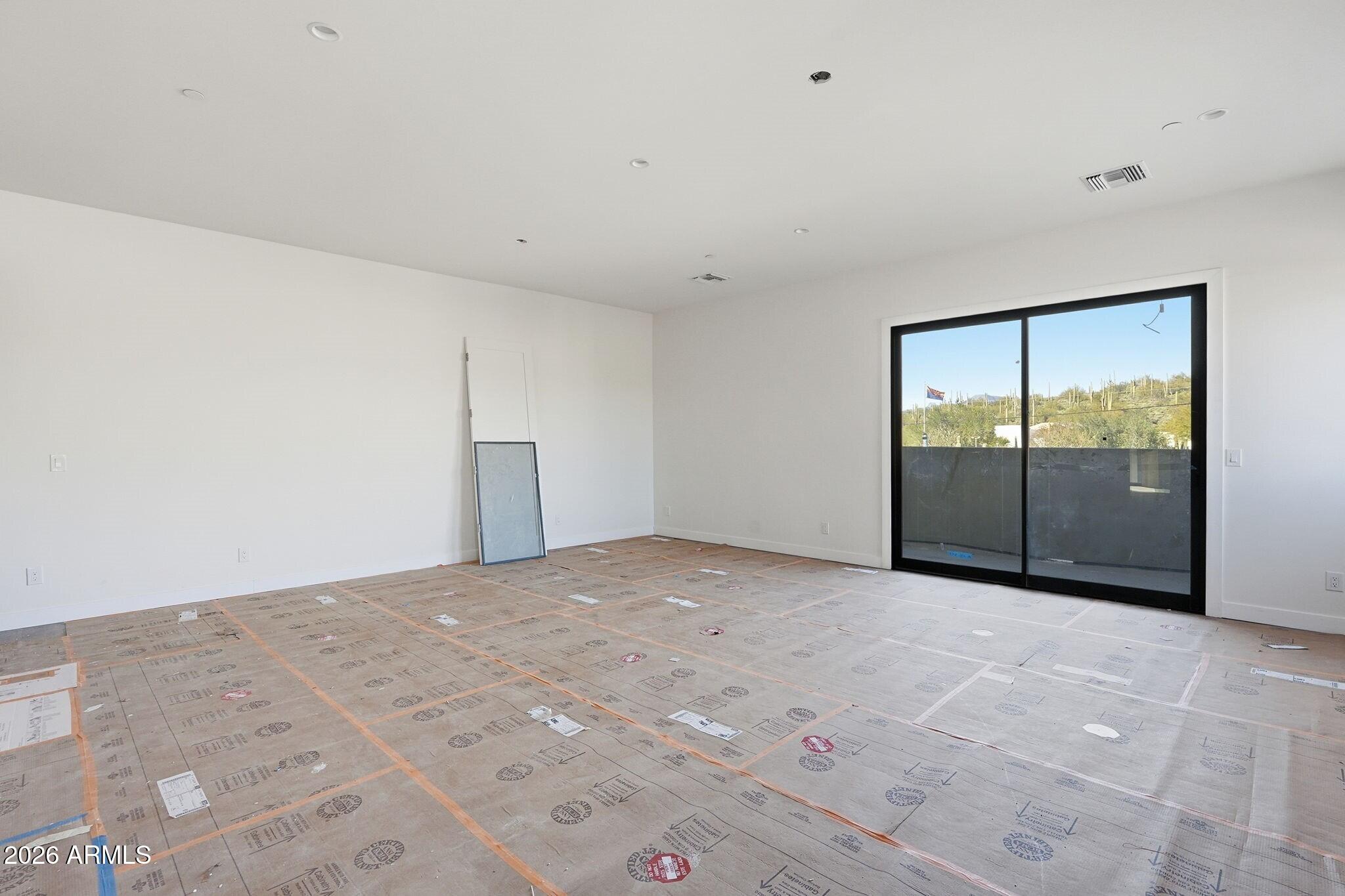 6525 East Cave Creek Road, Unit 105 Cave Creek, AZ 85331 - Photo 5 of 14 a view of an empty room with glass door