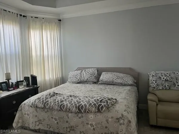 a bedroom with a bed and a couch