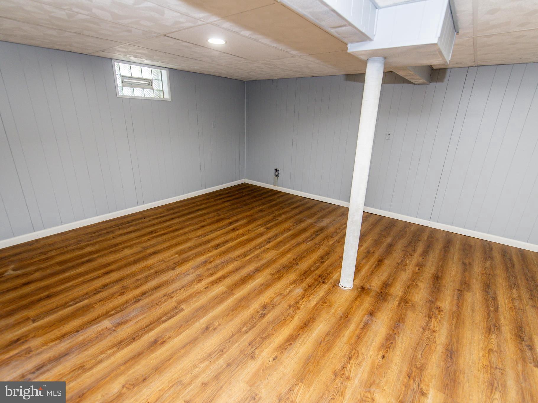 2605 Ambler Road Baltimore, MD 21222 - Photo 19 of 25 a view of empty room with wooden floor