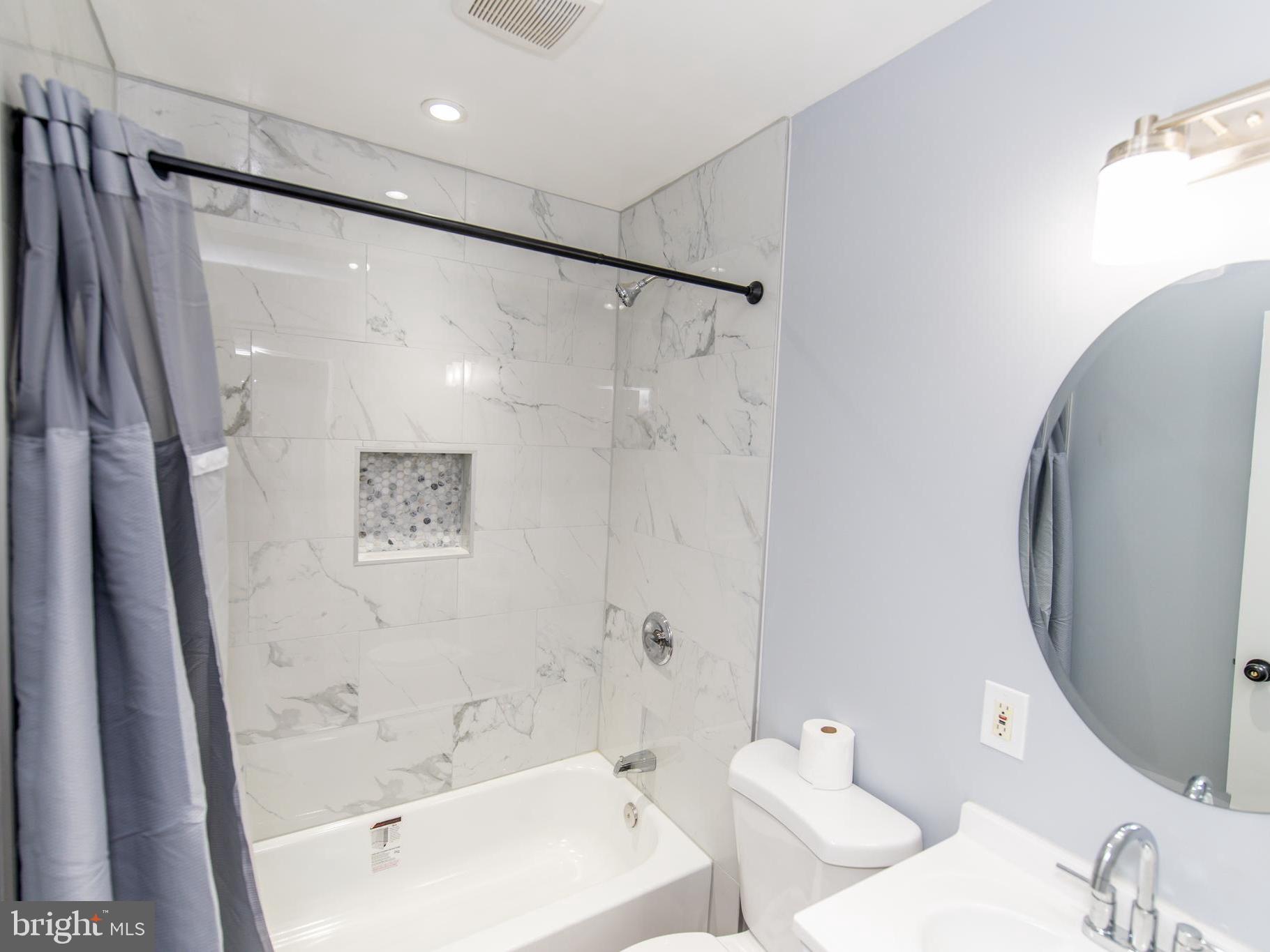 2605 Ambler Road Baltimore, MD 21222 - Photo 5 of 25 a bathroom with a bathtub and a shower