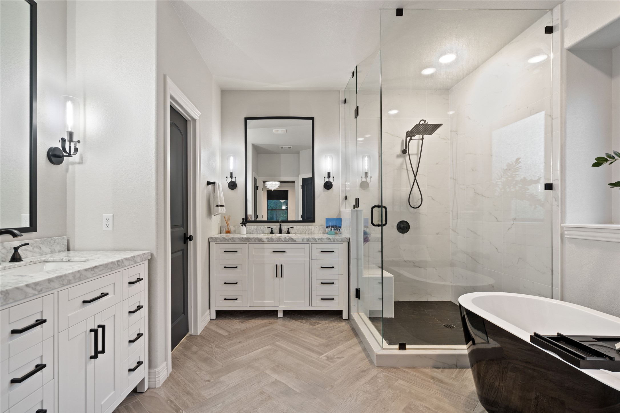 2829 Long Lasso Pass Leander, TX 78641 - Photo 21 of 40 a bathroom with a double vanity sink a mirror a bathtub and shower