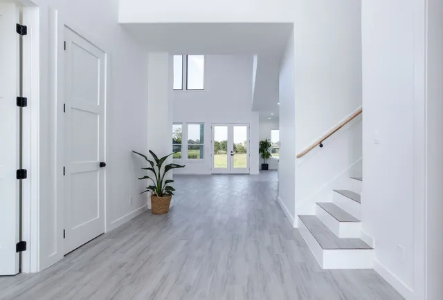 a view of an entryway with wooden floor
