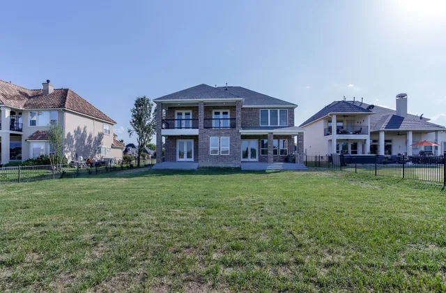 a view of a big yard in front of a house with a yard