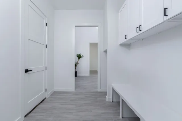 a view of hallway with wooden floor