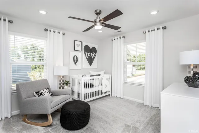 a bedroom with furniture and a window