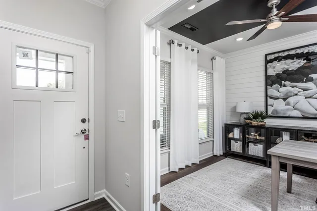 a view of workspace with window and wooden floor