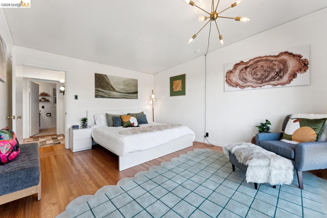 2301 Oak Street Berkeley, CA 94708 - Photo 16 of 61 Hardwood flooring throughout the room, complemented by a modern sputnik-style chandelier and recessed lighting