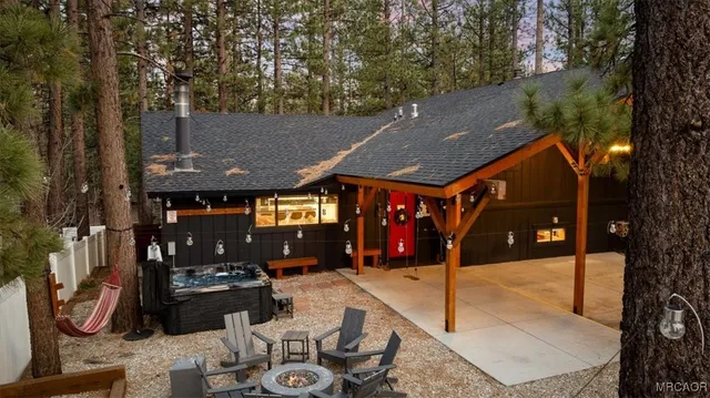 a view of a patio with a table and chairs under an umbrella