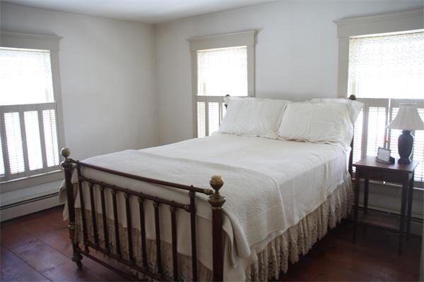 212 South Road Pepperell, MA 01463 - Photo 15 of 22 a bedroom with a bed and a window