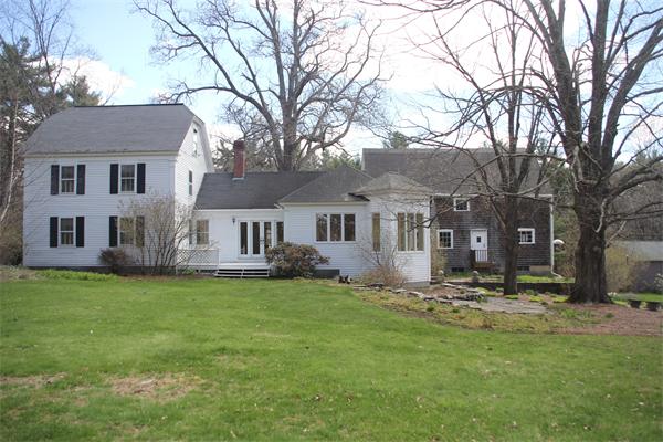 212 South Road Pepperell, MA 01463 - Photo 21 of 22 a front view of a house with a yard