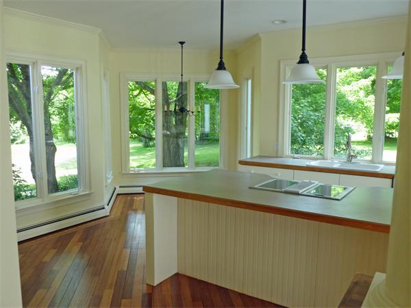 212 South Road Pepperell, MA 01463 - Photo 8 of 22 a view of a room that has a large window and chandelier